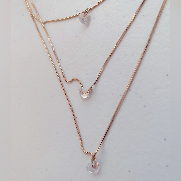 GOLDEN 3 LAYERED STAGGERED CHAIN NECKLACE WITH CLEAR JEWELED HEARTS - Picture 2 of 3